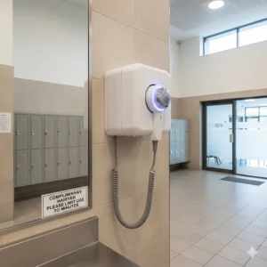 Heavy-duty wall mounted hair dryer designed for use in British leisure centres and gyms.