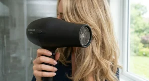 Alt text for image 5: A busy professional using a lightweight tourmaline hair dryer for a quick morning blow-dry.