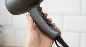 Close-up of the ergonomic, textured handle of the multi-speed hair dryer designed for comfortable, balanced styling.