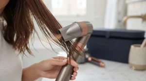 Pre-styling concentrator nozzle attachment on an all-in-one hair styling tool quickly drying damp hair prior to styling.