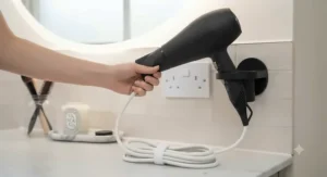 Ergonomic design of the hairdryer showing the flexibility of the 3m power cord.