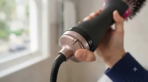 Temperature and speed control dial at the base of the Revlon One Step hair dryer.