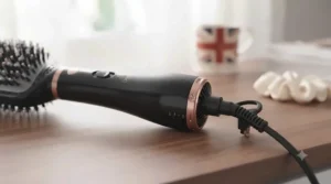 Close-up of an ergonomic, cool-touch handle and swivel cord on a premium paddle hair dryer.