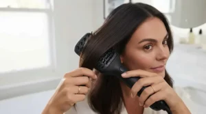 Before and after comparison showing frizz-free, salon-finish hair achieved using a flat paddle hot air brush.