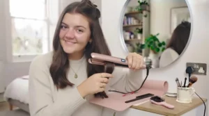 Ceramic straighteners resting safely on a pink heat-resistant styling mat