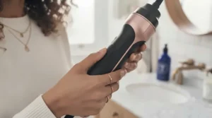 Ergonomic and lightweight handle of a hair dryer brush comfortable to hold during a styling routine.