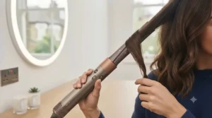 Long air-wrap curling barrels attached to the hair styler for creating bouncy waves.