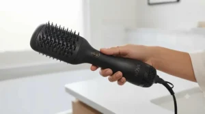 Compact flat paddle hot air styler featuring a tangle-free swivel cord, ideal for everyday use or travel.