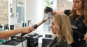 Using a tapered conical wand to style shorter or finer hair types without losing volume at the root.